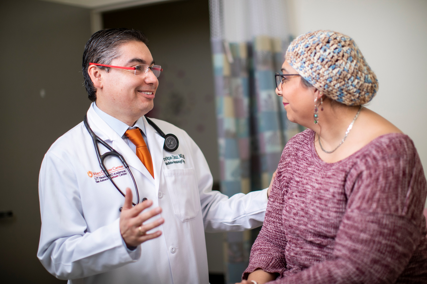 Mays Cancer Center physician with patient