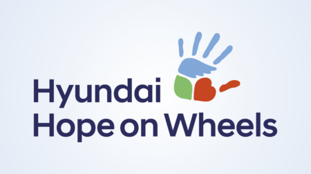 Logo of "Hyundai Hope on Wheels" featuring a blue handprint, green square, and red heart on a light blue background. Transcribed Text: Hyundai Hope on Wheels