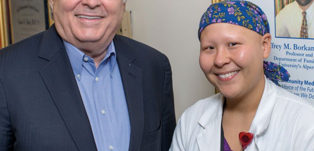 Dr. Holly congratulates Summer Scavone on her completion of the patient-centered medical home externship he developed.