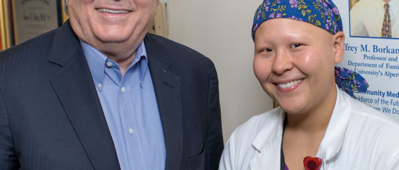 Dr. Holly congratulates Summer Scavone on her completion of the patient-centered medical home externship he developed.