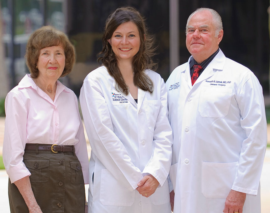 Kenneth Sirinek, M.D., Ph.D., (right) and Connie Aust, (left) wife of the late J. Bradley Aust, M.D., Ph.D., congratulate Katie Wiggins-Dolvik, M.D. the first recipient of the Dr. Ken and Peg Sirinek Endowed Scholarship in General Surgery at the UT Health Science Center.