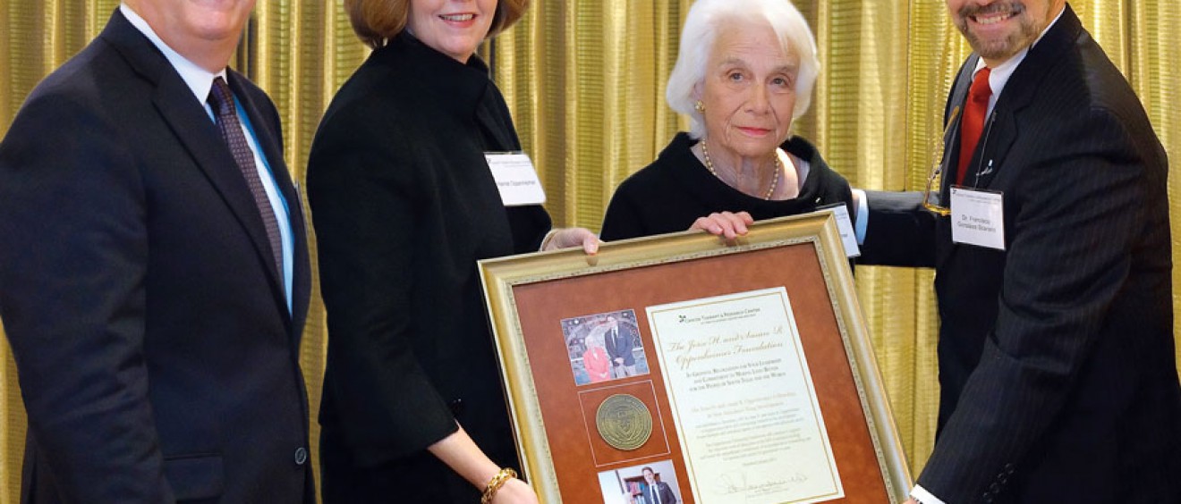 (Pictured above) Francisco González-Scarano, M.D., dean of the Long School of Medicine and vice president for medical affairs (right), presents Susan R. Oppenheimer (center) with a plaque of appreciation for her dedicated support.