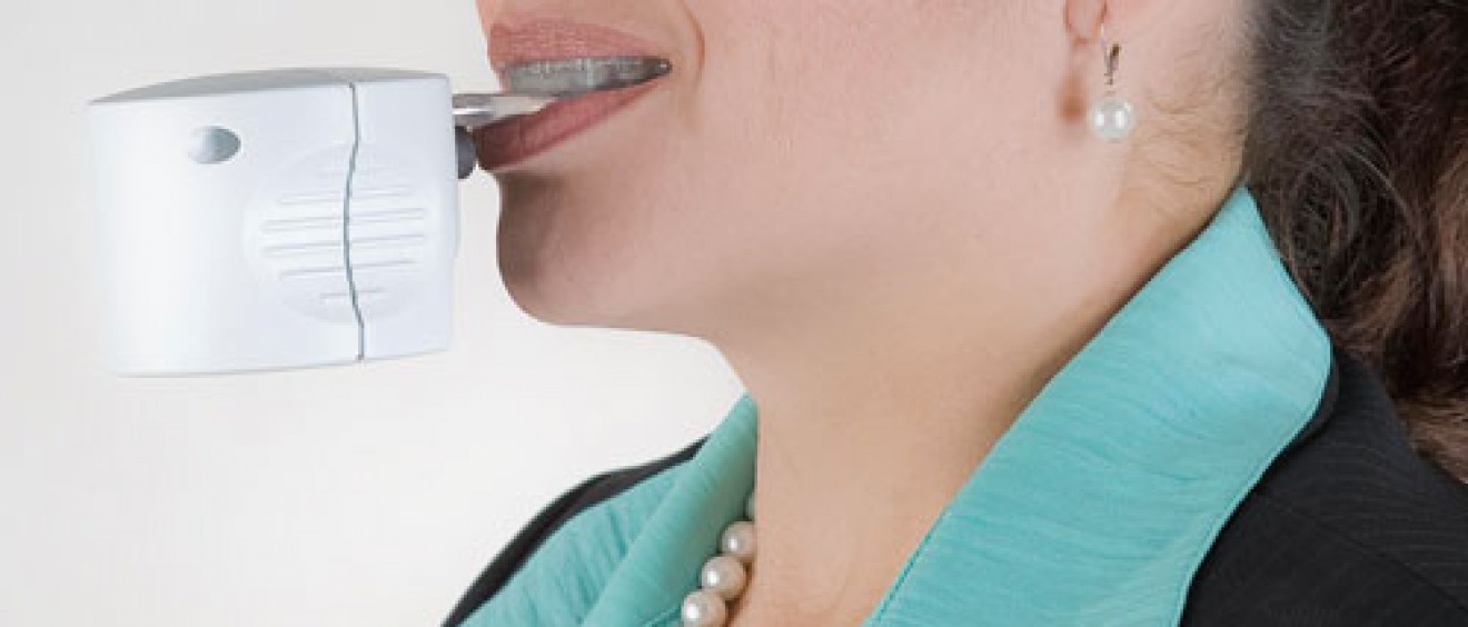 An earlier model of the AcceleDent is the device used in the current Health Science Center study. Denice Jimenez, an Orthodontic Clinic patient, demonstrates how the AcceleDent device is used.