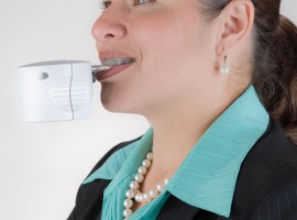 An earlier model of the AcceleDent is the device used in the current Health Science Center study. Denice Jimenez, an Orthodontic Clinic patient, demonstrates how the AcceleDent device is used.