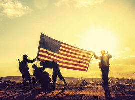 WWII soldiers raising the American flag