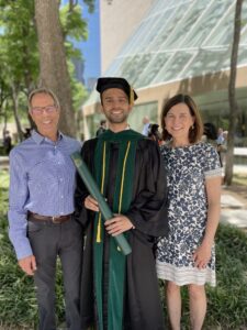 Mentors Jim Karlak (left) and Emily Karlak, are featured with Chandra Subedi, MD, at his graduation from The University of Texas Southwestern Medical Center.