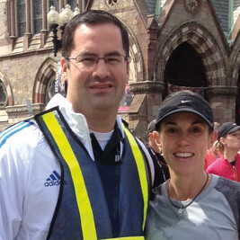 Alumnus Jorge A. Alvarez, M.D., congratulates his wife, Rebecca, after she crosses the Boston Marathon finish line. Despite the shock of the tragedy that occurred thereafter, Dr. Alvarez took immediate action to help the injured.