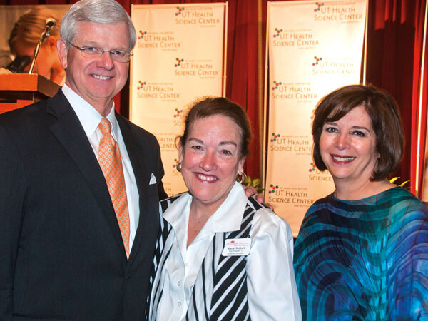 (Left to right) Nursing Advisory Committee Chair Gregg Muenster stands with keynote speaker Maria Wellisch, RN, B.B.A., LNFA, and School of Nursing Dean Eileen T. Breslin, Ph.D., RN, FAAN.