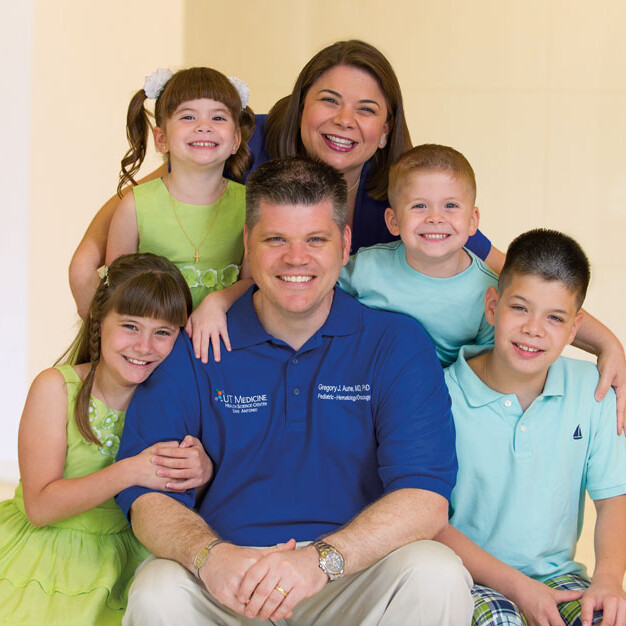 Gregory Aune, M.D., Ph.D., is pictured with his wife, Christine Aune, M.D., and his children: 10-year-old twins Emma and Noah (seated) and 5-year-old twins Sophia and Elijah (standing).