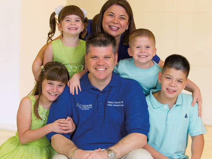 Gregory Aune, M.D., Ph.D., is pictured with his wife, Christine Aune, M.D., and his children: 10-year-old twins Emma and Noah (seated) and 5-year-old twins Sophia and Elijah (standing).