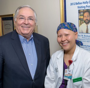 Dr. Holly congratulates Summer Scavone on her completion of the patient-centered medical home externship he developed.