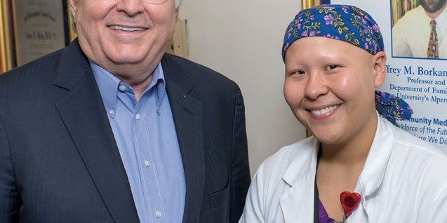 Dr. Holly congratulates Summer Scavone on her completion of the patient-centered medical home externship he developed.