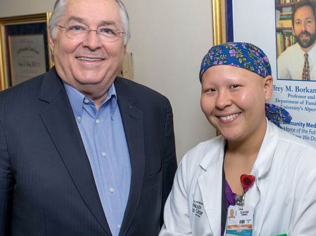 Dr. Holly congratulates Summer Scavone on her completion of the patient-centered medical home externship he developed.
