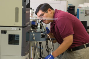 researcher using mass spectrometer