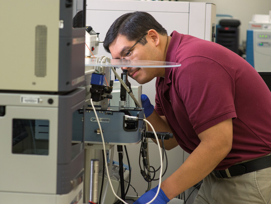 researcher using mass spectrometer