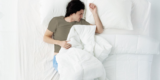 man sleeping in bed.