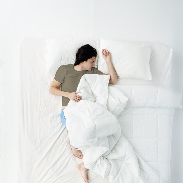 man sleeping in bed.