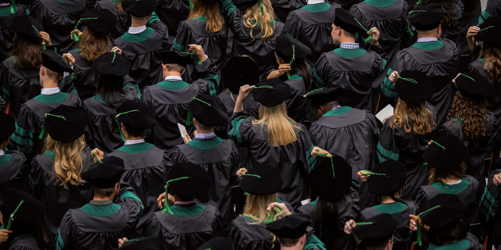 graduates at commencement