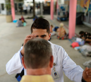 medical student examines patient