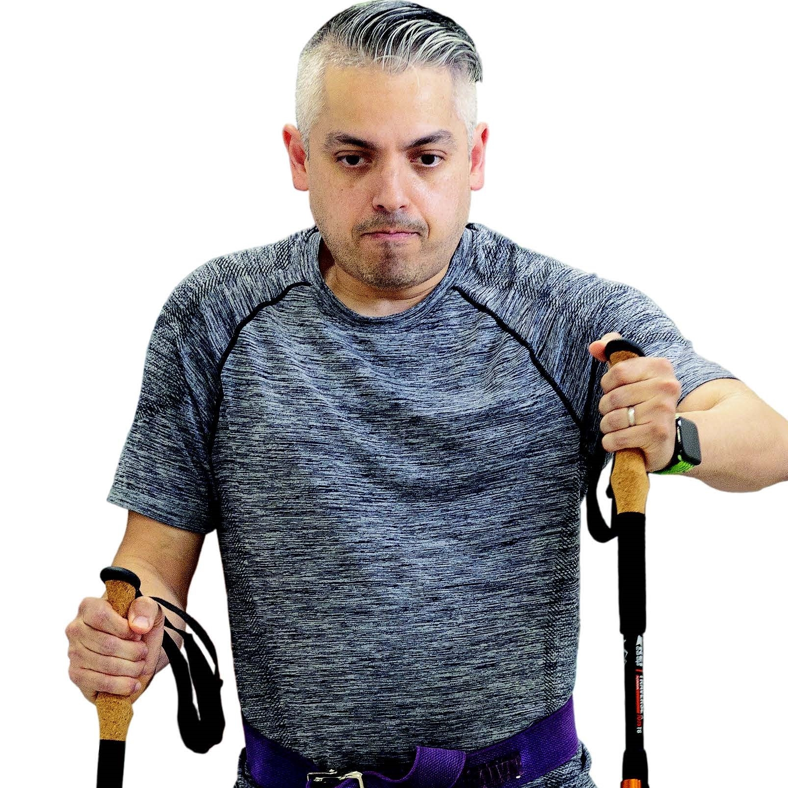 A patient walks with the aid of walking sticks