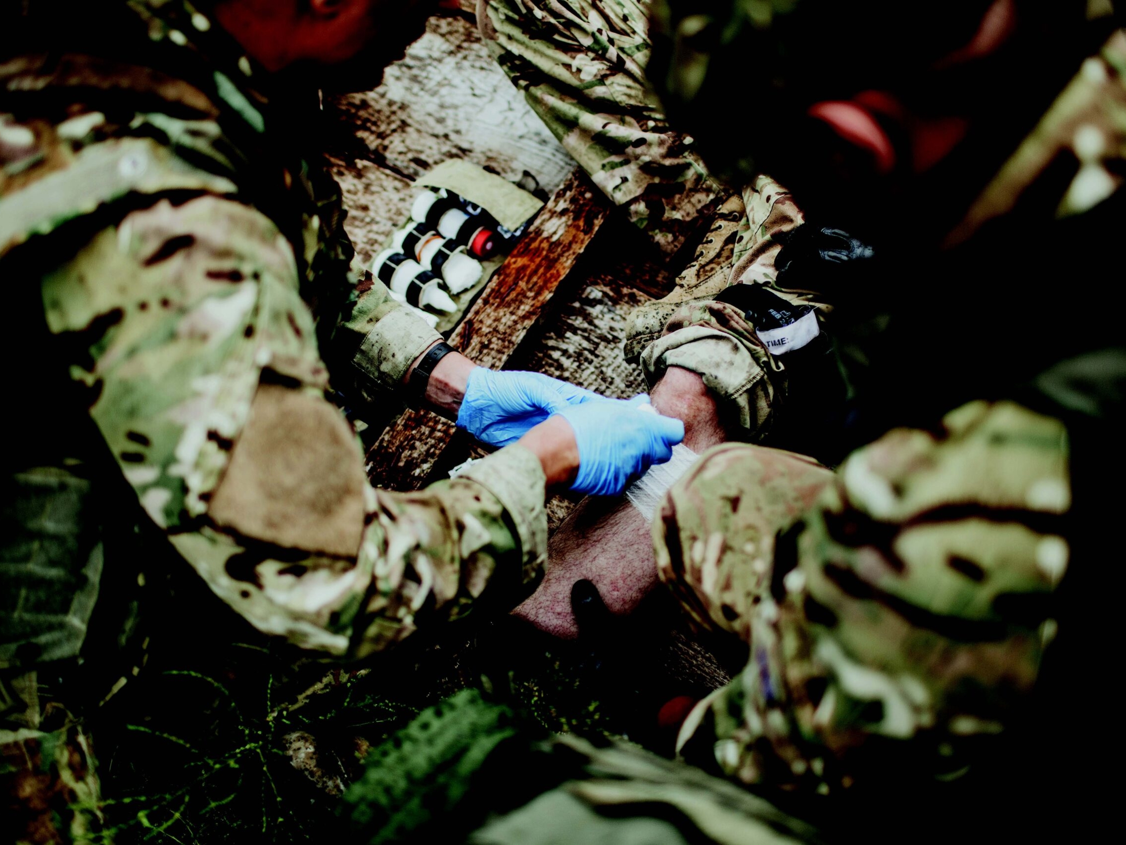stock image of military medics treating trauma patient