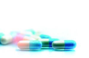 several capsules scattered on flat surface