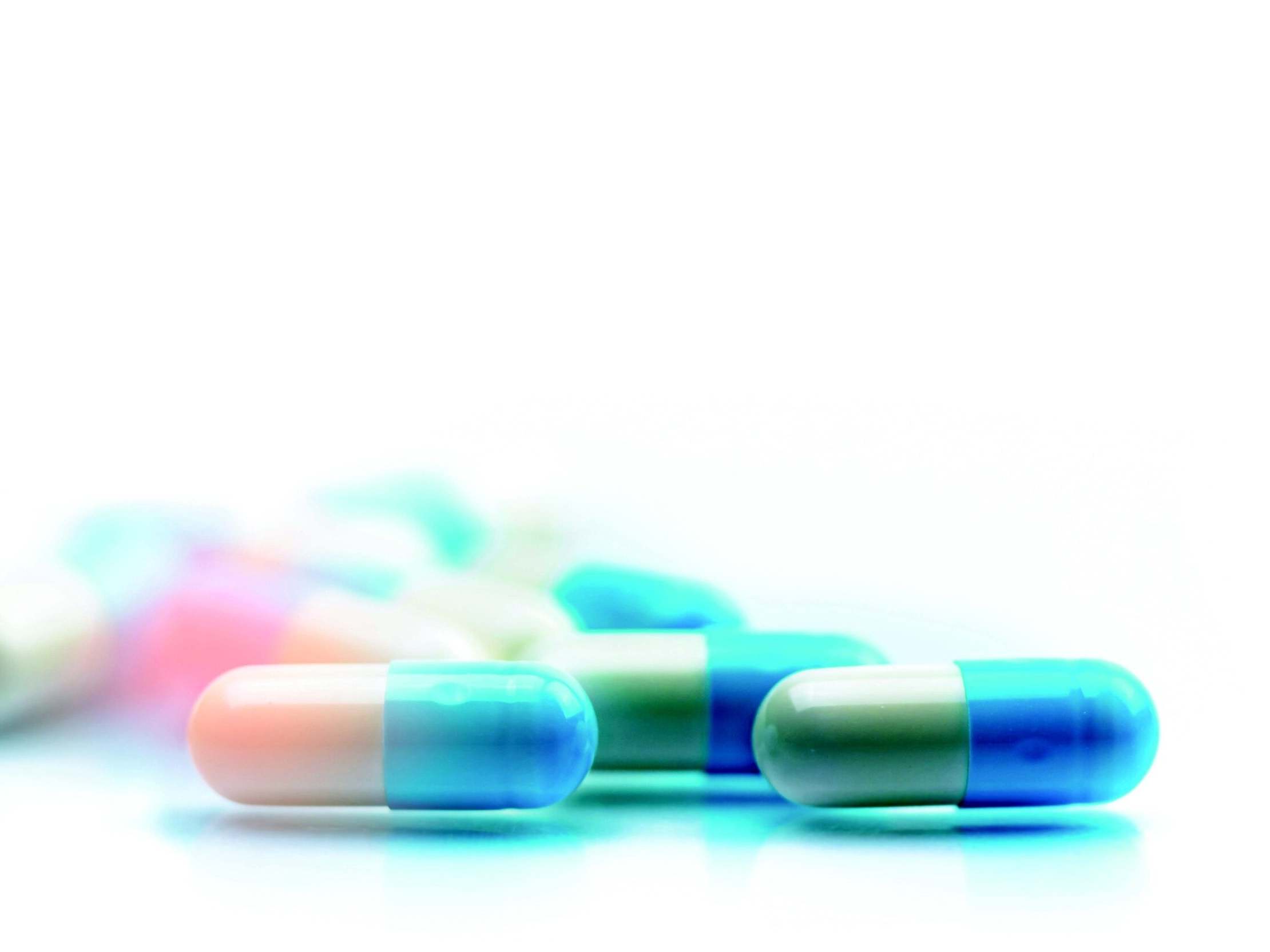 several capsules scattered on flat surface