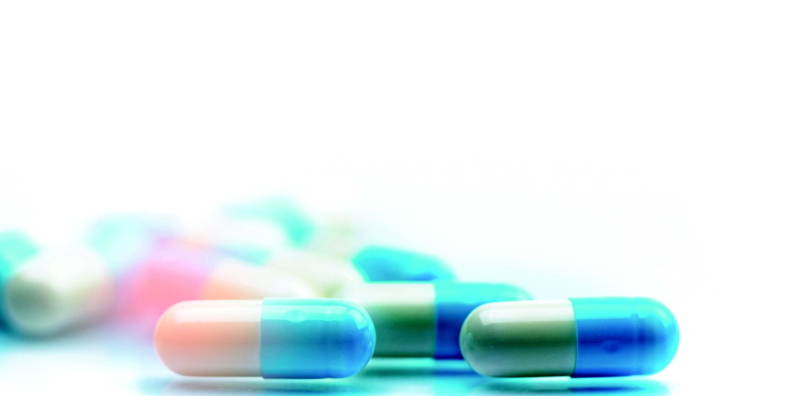 several capsules scattered on flat surface