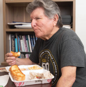 Photo of patient Carlos González consuming a meal to show progress with swallowing food