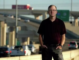 Brian Purcell standing in front of highway
