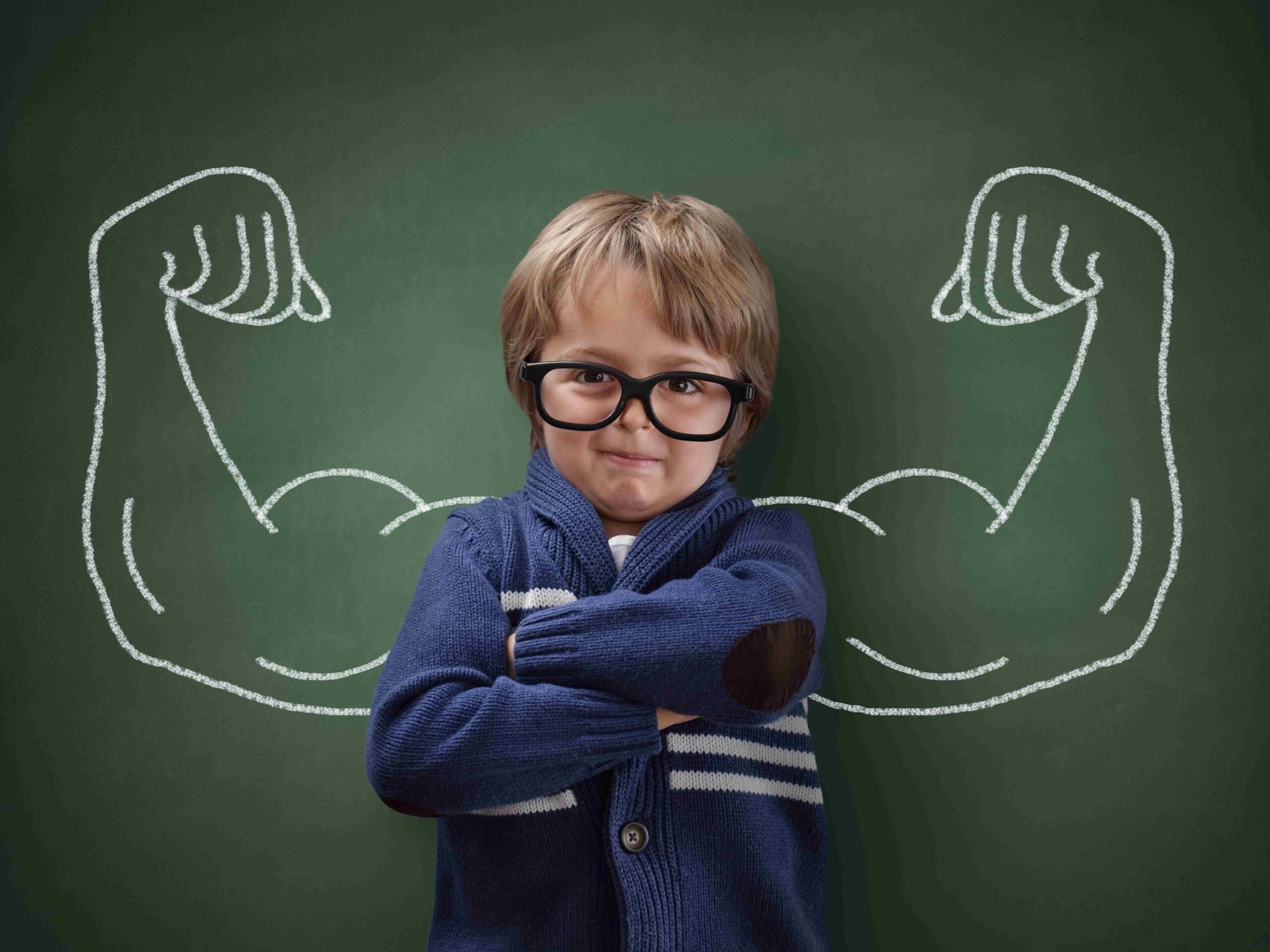 boy in front of chalkboard