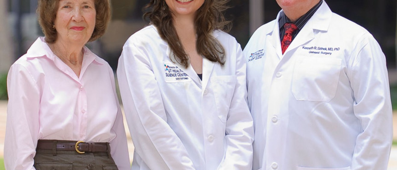 Kenneth Sirinek, M.D., Ph.D., (right) and Connie Aust, (left) wife of the late J. Bradley Aust, M.D., Ph.D., congratulate Katie Wiggins-Dolvik, M.D. the first recipient of the Dr. Ken and Peg Sirinek Endowed Scholarship in General Surgery at the UT Health Science Center.