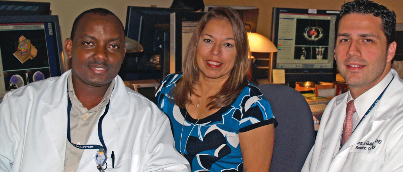 Titus Kyenzeh (left) is a student in the Department of Radiation Oncology’s medical dosimetry certification program, which just earned accreditation thanks to a yearlong effort by Clinical Director Diana Baacke (center), Education Director Alonso Gutiérrez, Ph.D., (right) and the program’s director, Nikos Papanikolaou, Ph.D., (not pictured).