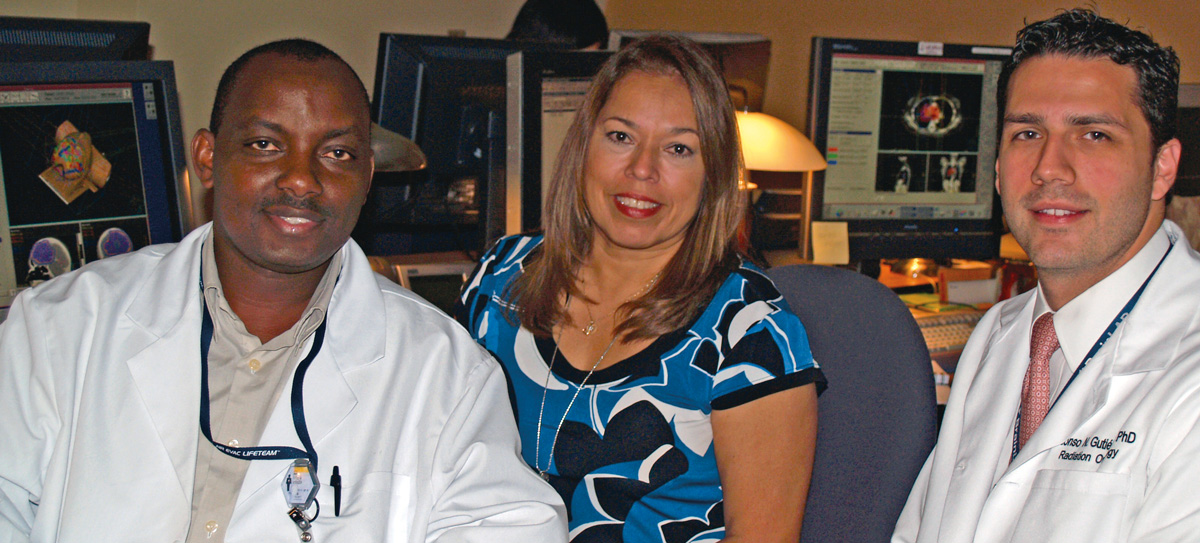 Titus Kyenzeh (left) is a student in the Department of Radiation Oncology’s medical dosimetry certification program, which just earned accreditation thanks to a yearlong effort by Clinical Director Diana Baacke (center), Education Director Alonso Gutiérrez, Ph.D., (right) and the program’s director, Nikos Papanikolaou, Ph.D., (not pictured).