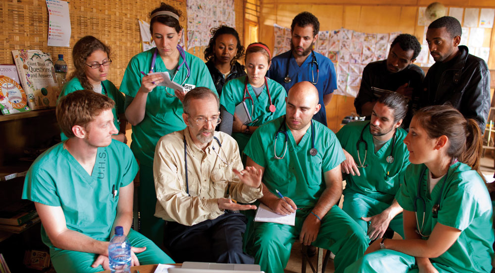 Students listen intently to Richard Usatine, M.D., as he mentors and prepares them to work in Student-Run Free Clinics.