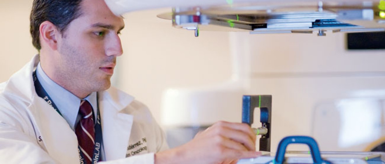 Alonso N. Gutiérrez, Ph.D., a medical physicist and professor of radiation oncology at the CTRC at the UT Health Science Center, prepares a patient for treatment with the Novalis Tx™.