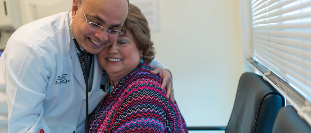 Dr. Anand Karnad hugs a patient.