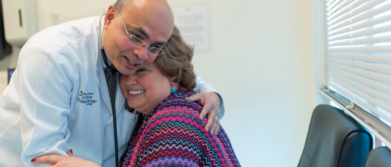 Anand Karnad, M.D. hugging patient