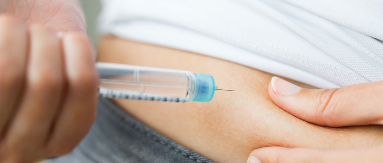 person giving insulin shot