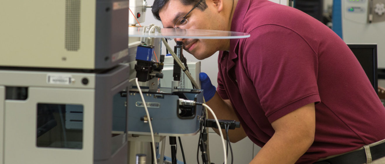 researcher using mass spectrometer