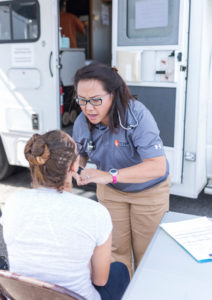 Wendy J. Lee examines a patient in Rockport, Texas.