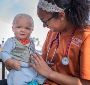 Alecia Gray holds a baby in Rockport, Texas.