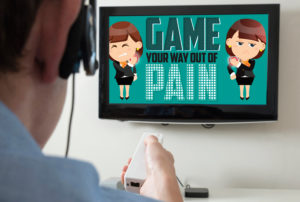 man playing video game, screen says "game your way out of pain"