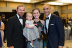 Zack and Jennie Winkler hold baby Evie, alongside S. Adil Husain, M.D., pediatric cardiothoracic surgeon, who has performed multiple surgeries on Evie to repair her heart.