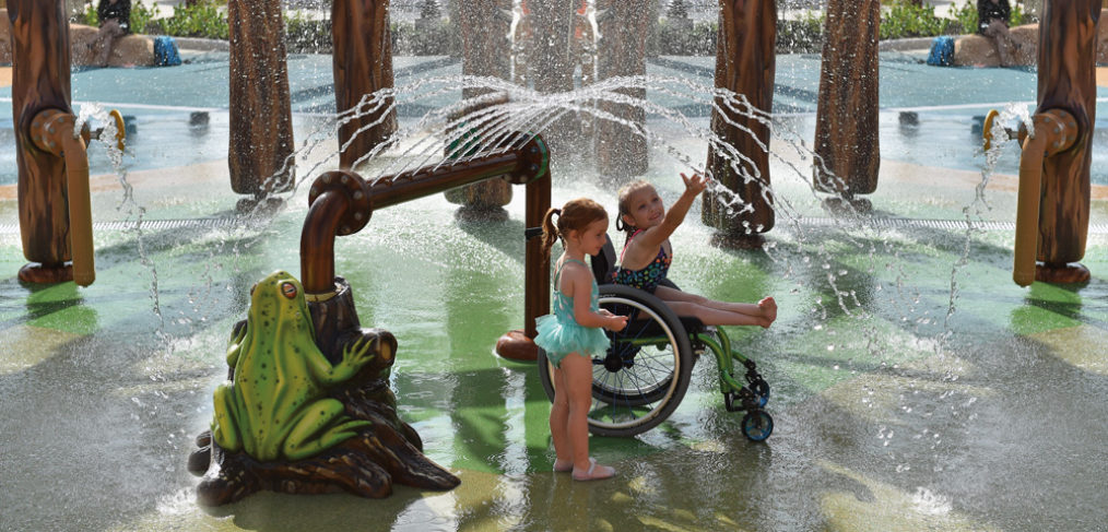 children playing in water park