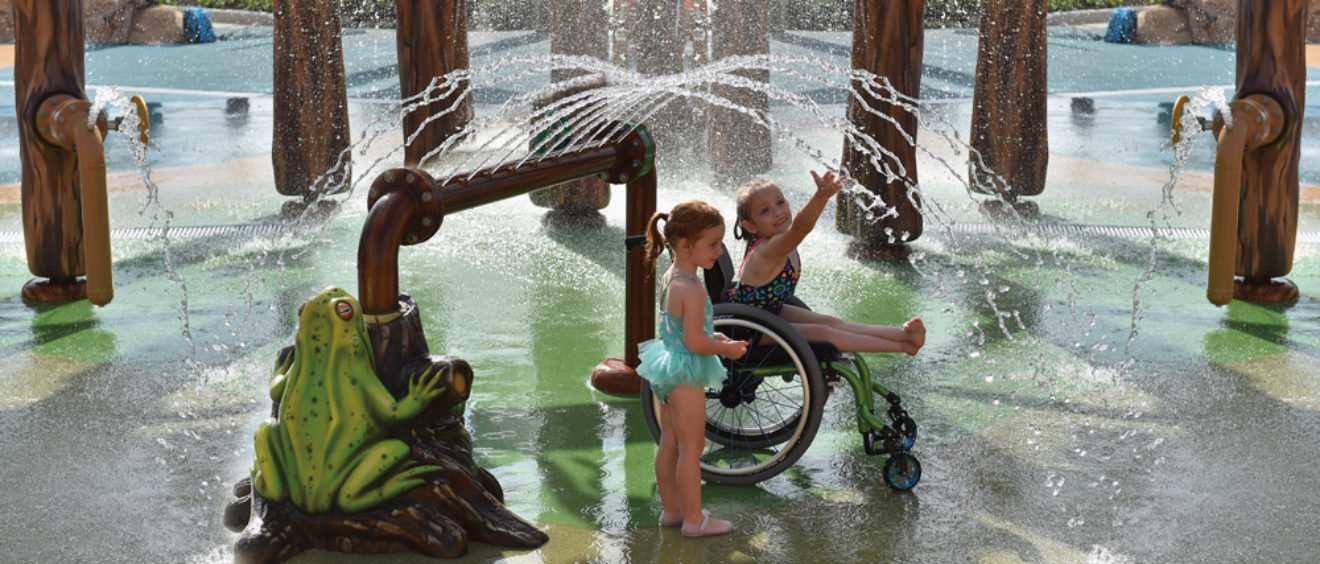 children playing in water park