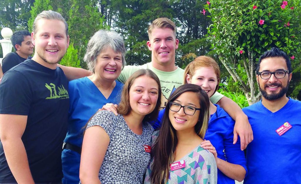 Faculty members Janis Rice (back row, second from left) and Dr. Frank Puga (far right) work with students to help patients during mission trips to Guatemala. Pictured with them are School of Nursing Class of 2015 graduates who, while they were students, participated in the mission trips. They are (back row, left to right) Adam Rick, Sean Brady, Amy Lynn Rose, (front row, left to right) Christine Johnson, and Ann Lee.