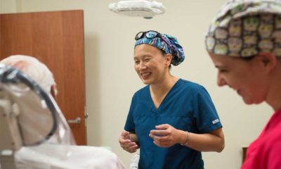 Tam Van, D.D.S, director of the Geriatric Dentistry Clinic, works with Keely Long, third-year dental student, to provide dental care to longtime patient Kenneth Albert.
