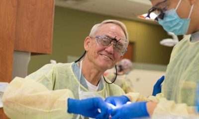 Roger Weed, D.D.S., FACD, associate professor of comprehensive dentistry, works with Vincent Hsu, a fourth-year dental student, in the general dentistry clinic.