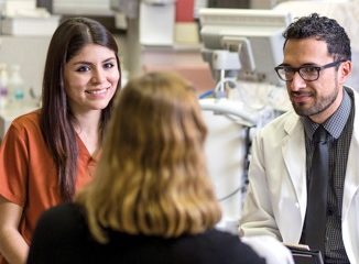 Cristina Cruz, Bachelor of Science in Nursing student, works with faculty mentor Frank Puga, Ph.D., on a research project studying how social support affects the mental health of pregnant women with opioid use disorders.
